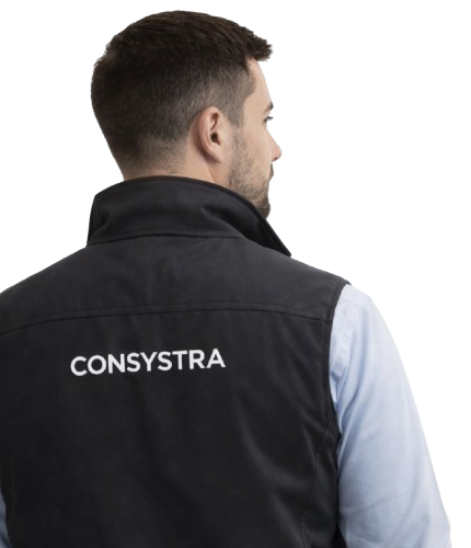 A person seen from behind wearing a black vest with the word 'CONSYSTRA' printed on it.